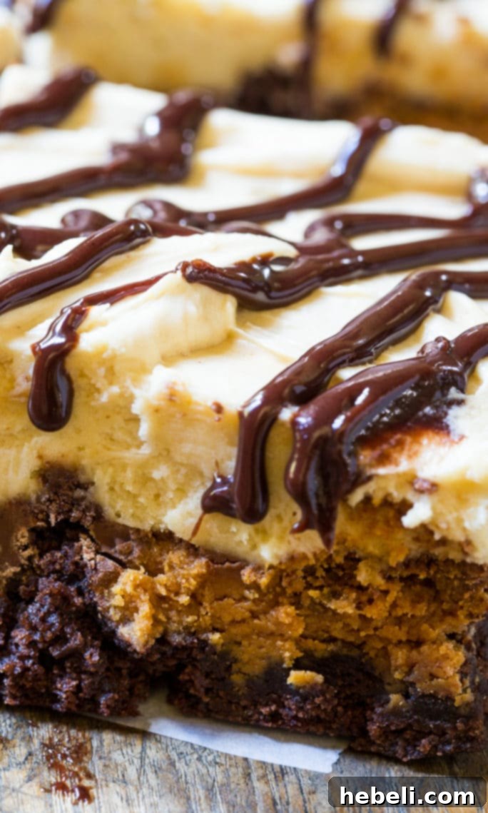 A single serving of Peanut Butter Cup Brownies presented with a fork, highlighting the delicious layers