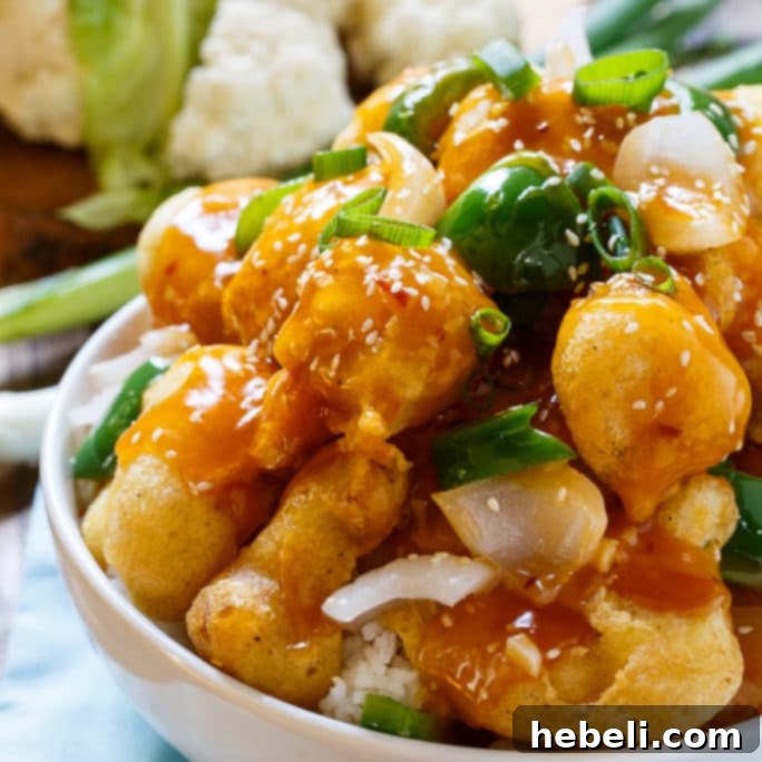 Crispy Sesame Cauliflower topped with sesame seeds and green onions