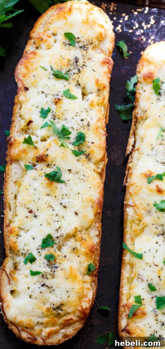 Ooey Gooey Garlic Bread 2 Freshly baked cheesy garlic bread, golden and crispy, perfect as a side dish.
