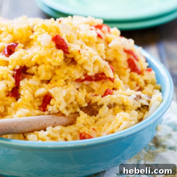Creamy Pimento Cheese Rice 2 Delicious Pimento Cheese Rice, a creamy and flavorful Southern side dish ready to be served.