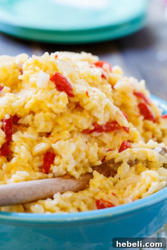 Creamy Pimento Cheese Rice 3 Close-up of Pimento Cheese Rice showing its creamy texture and visible pimentos.