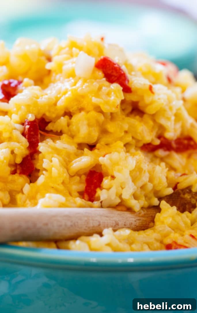 Creamy Pimento Cheese Rice 4 Sautéing onions in butter for Pimento Cheese Rice.