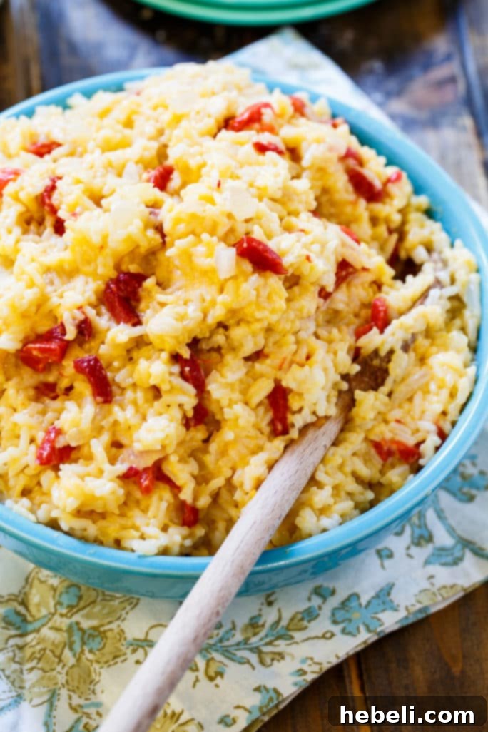 Creamy Pimento Cheese Rice 5 Pimento Cheese Rice ready to be served, showcasing its vibrant color and cheesy appeal.