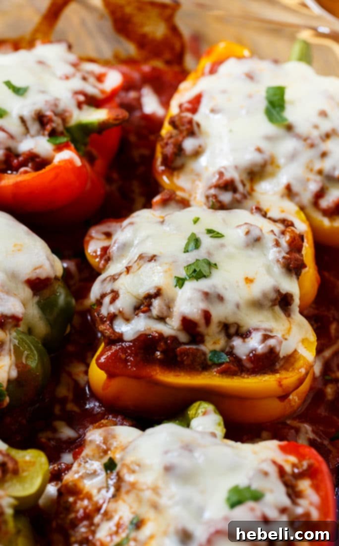 Lasagna Bell Pepper Bake 10 Close-up of baked Lasagna Stuffed Peppers, showcasing golden melted cheese and vibrant bell peppers.