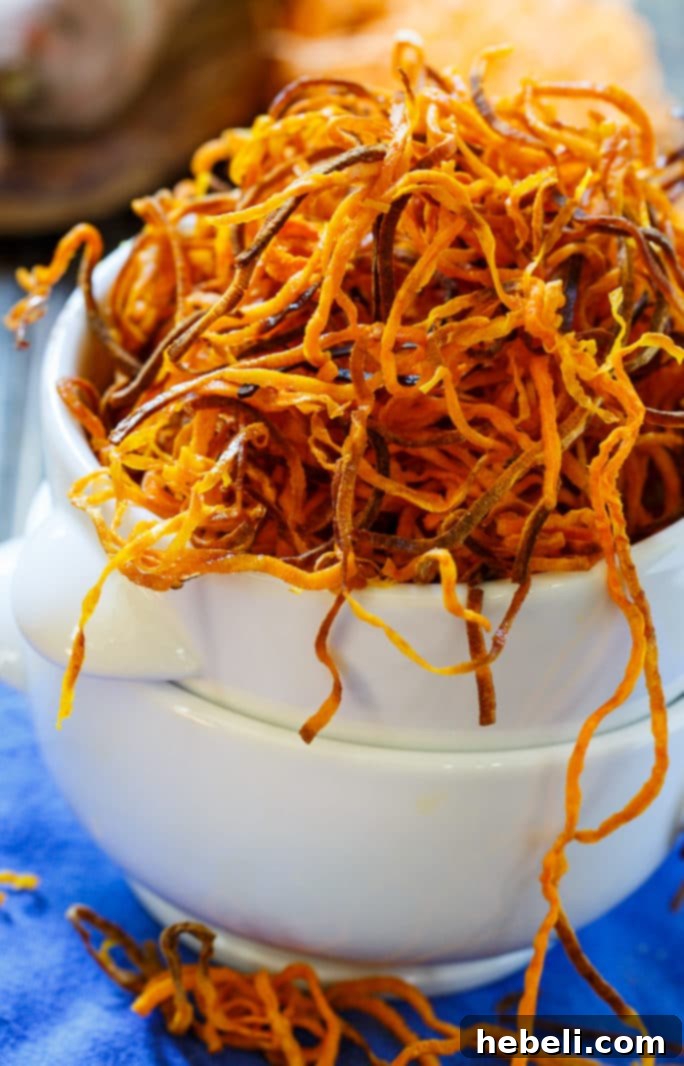 A large serving of crispy baked sweet potato straws, perfect for snacking