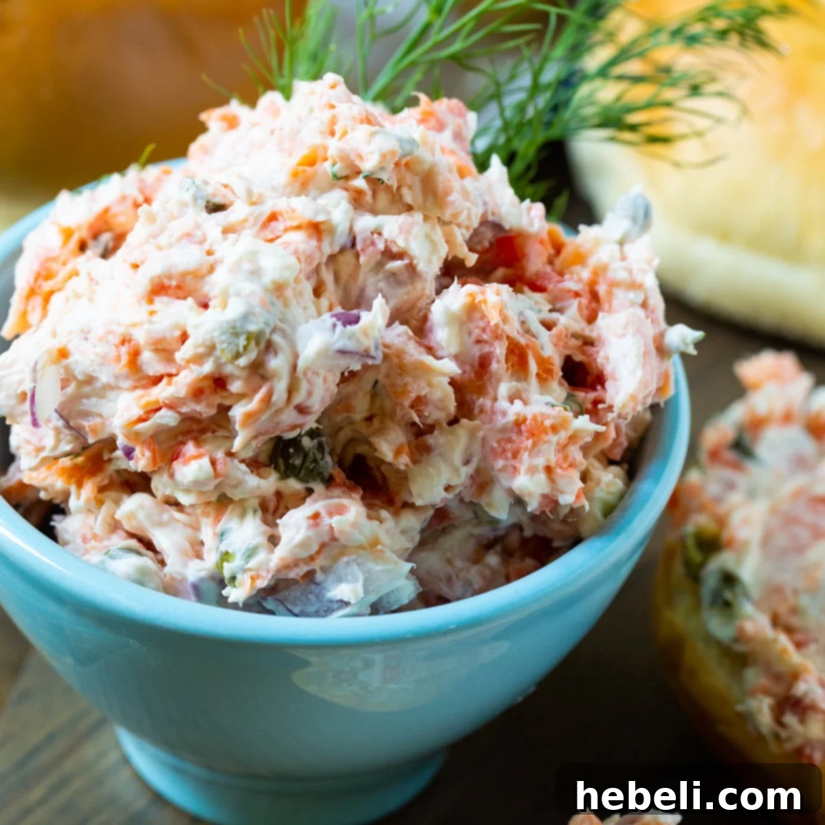 Smoked Salmon Mousse 2 Creamy Smoked Salmon Spread in a small blue ceramic bowl, garnished with fresh dill.