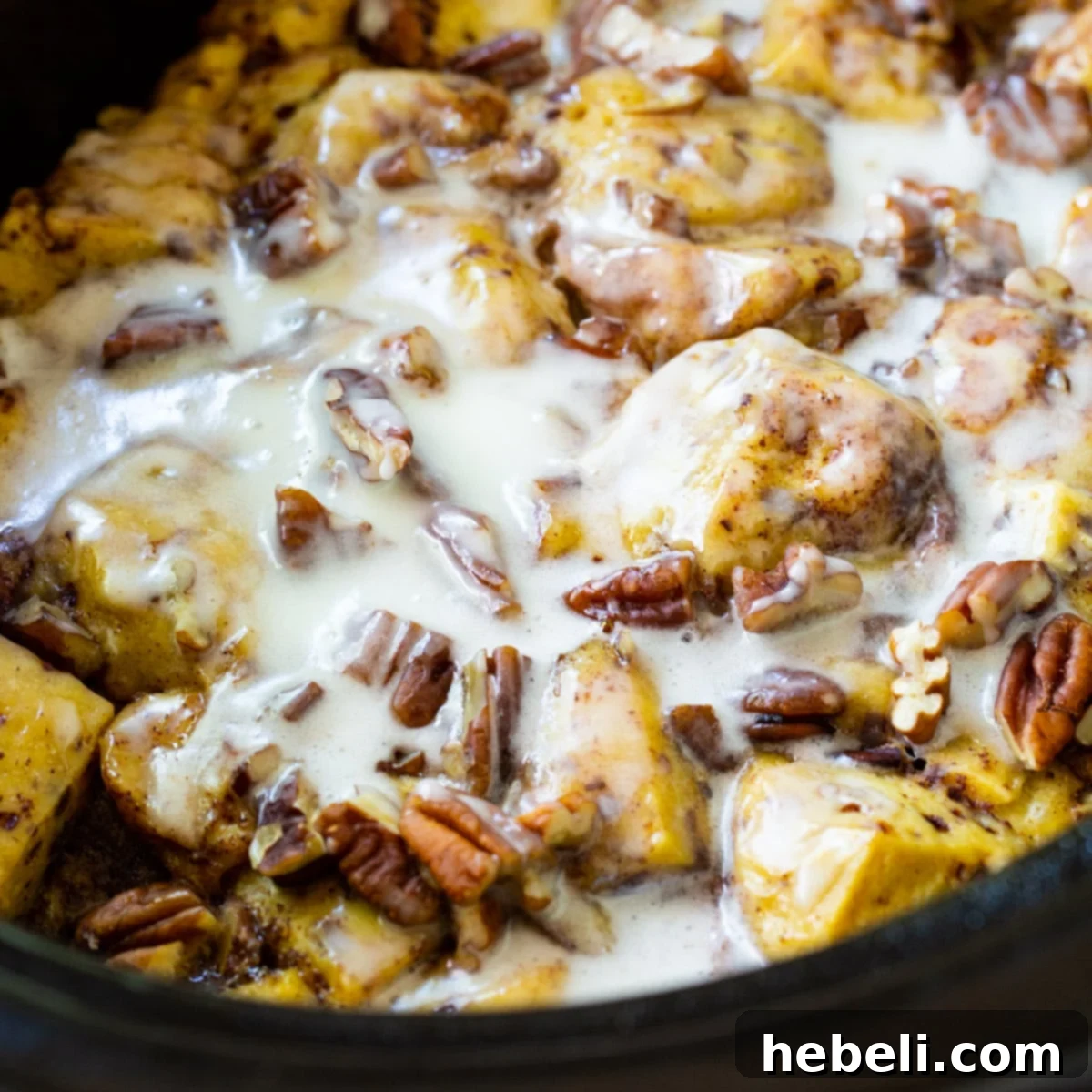 Delicious Crock Pot Cinnamon Roll Casserole freshly cooked in a slow cooker, ready to serve.