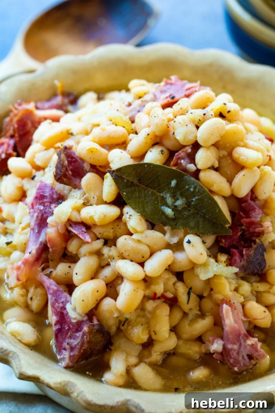 Hearty Slow Cooker White Beans 3 A closer look at Slow Cooker White Beans with ham hocks, showcasing their creamy texture.