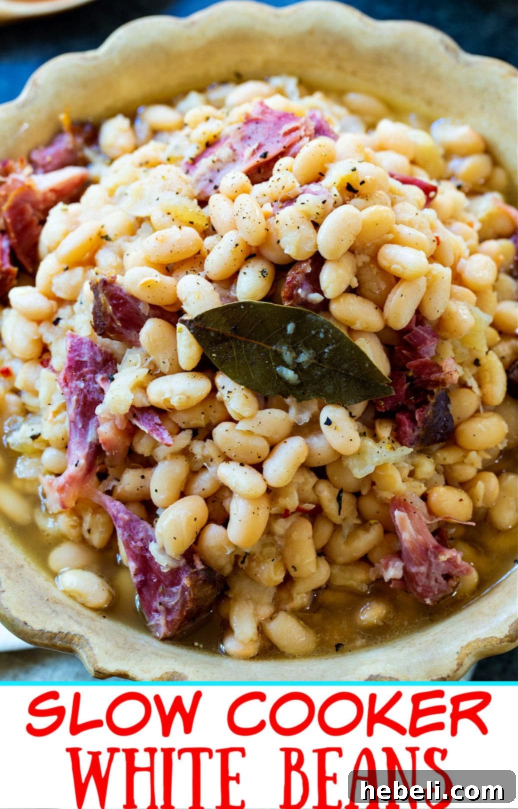 Hearty Slow Cooker White Beans 4 Hearty slow cooker white beans with ham hocks, a perfect meal for chilly evenings.