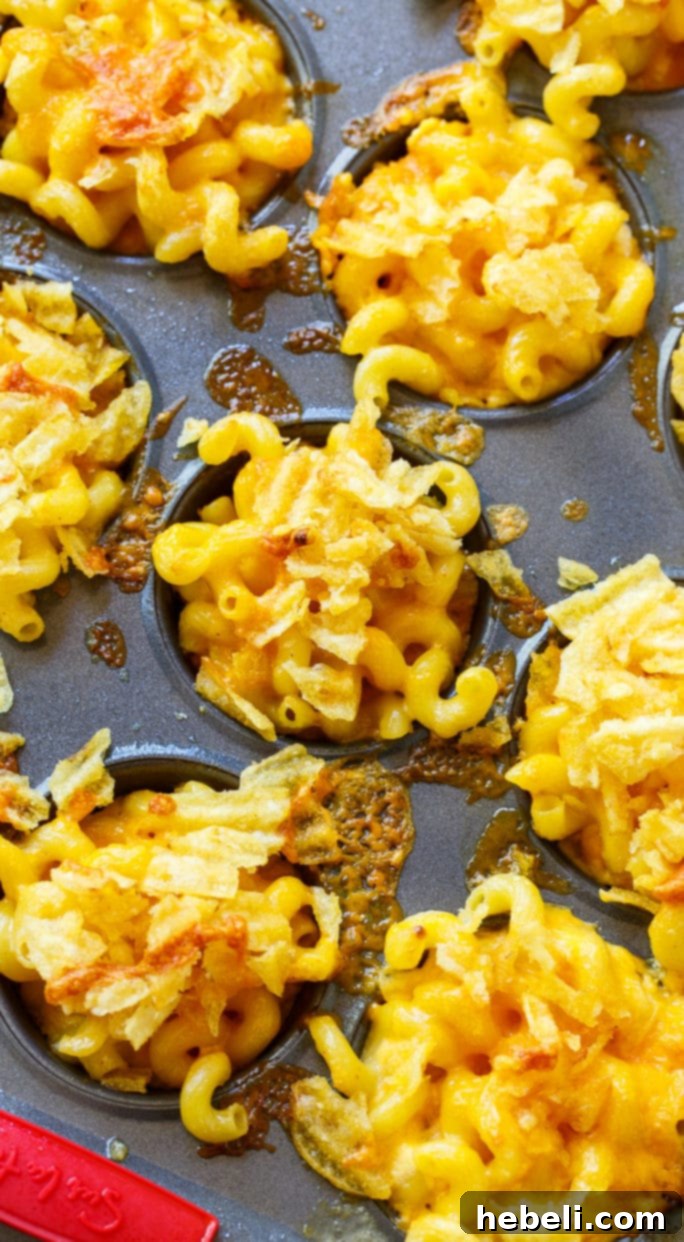Close-up of golden brown Mac and Cheese Muffins, ready to be served