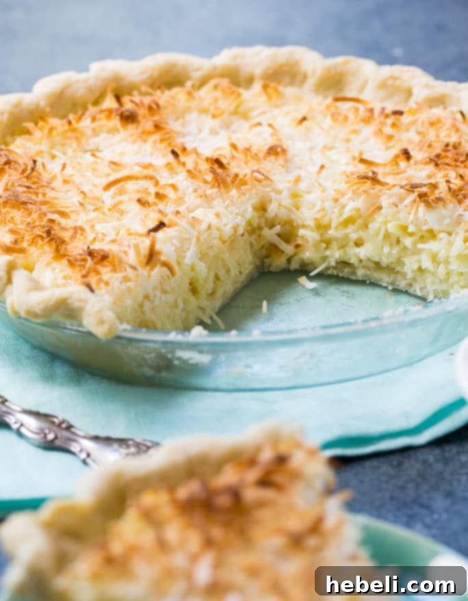 Sweetened condensed milk being poured, illustrating its richness for the pie.