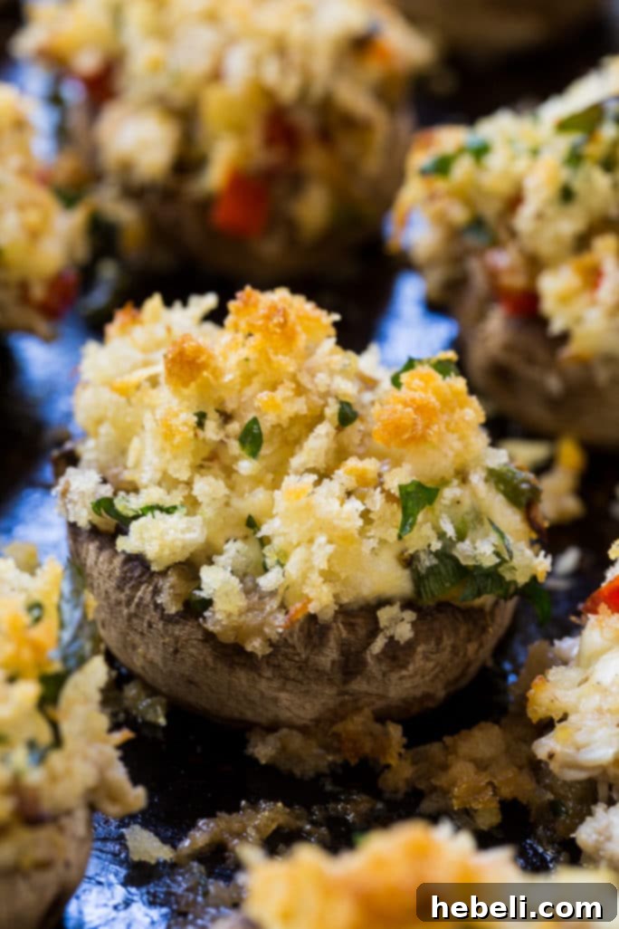 Decadent Crab Stuffed Mushrooms 4 Tray of golden brown Crab Stuffed Mushrooms