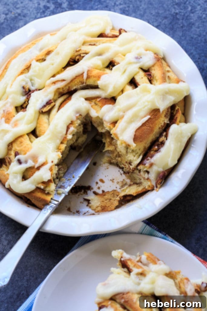 Finished Giant Cinnamon Roll covered in cream cheese glaze