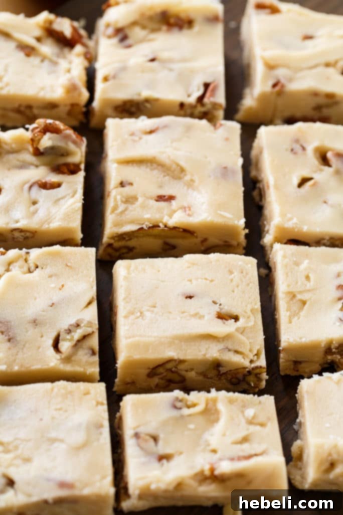 Close-up of a slice of Butter Pecan Fudge, showing its creamy texture and pecan bits