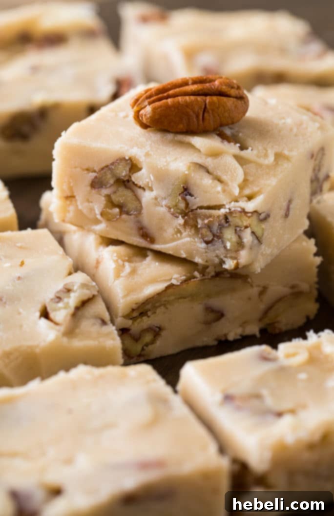 A close-up of the Butter Pecan Fudge mixture being stirred in a saucepan before cooling