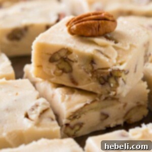 A square of perfectly cut Butter Pecan Fudge on a serving plate