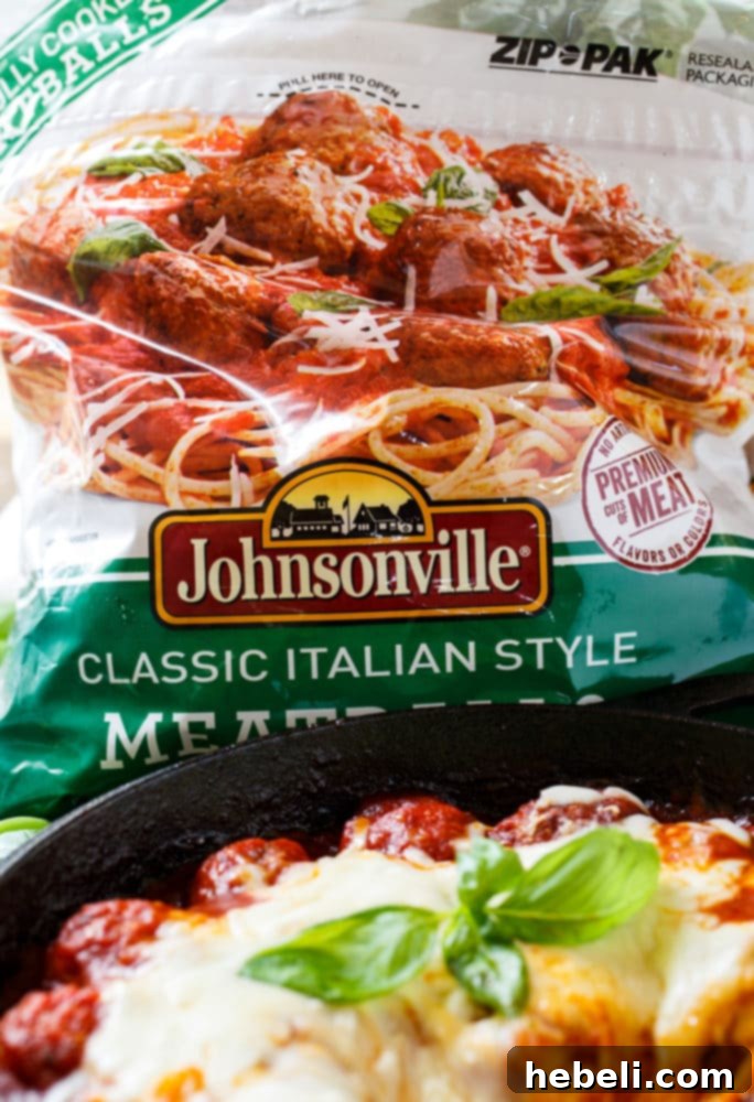 Cheesy Skillet Meatballs featuring delicious, fully cooked Johnsonville Meatballs simmering in sauce.