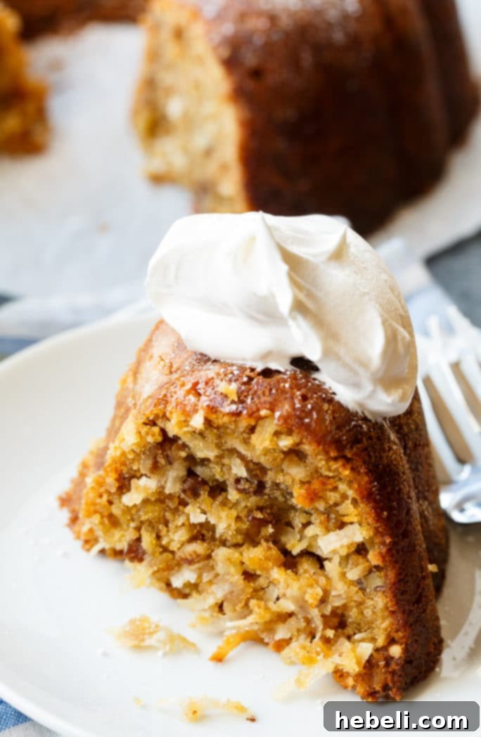 Close-up of a whole Vanilla Wafer Cake with Coconut, showcasing its beautiful bundt shape and inviting texture, ready to be sliced.