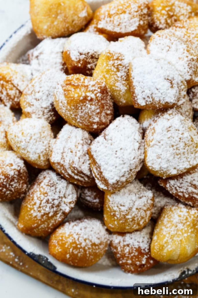 Golden Biscuit Fritters 3 Close-up of fluffy Biscuit Beignets, showcasing their light and airy texture