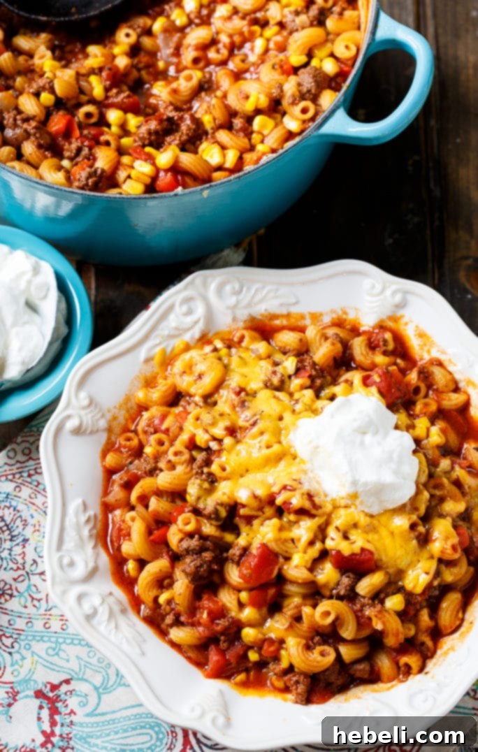 A large pot of Southern Ghoulash with ground beef and pasta, ready to serve.