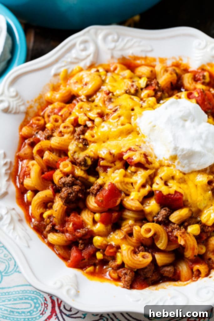 Southern Ghoulash with ground beef and pasta, garnished and ready to be served.