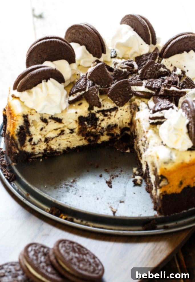 Oreo Cheesecake is super creamy with lots of oreo cookie chunks, making it the perfect cookies and cream dessert.