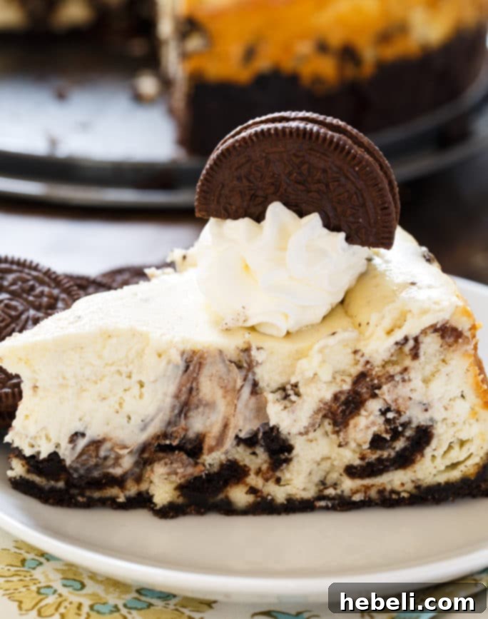 Oreo Cheesecake is super creamy with lots of oreo cookie chunks, a delightful treat for any occasion.
