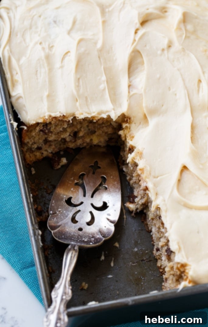 Slice of Hummingbird Cake with Caramel Frosting and Pecans