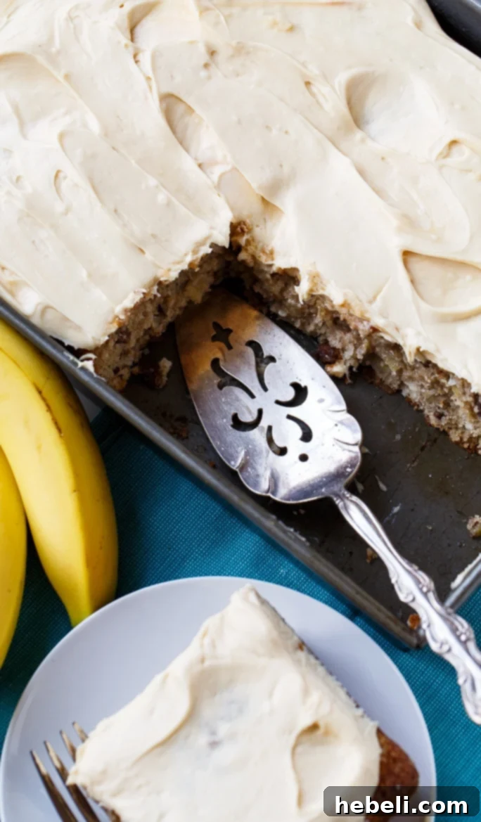Caramel Icing Being Spread on Hummingbird Cake