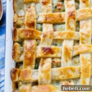Chicken Pot Pie with Lattice Top in a serving dish, ready to be carved.