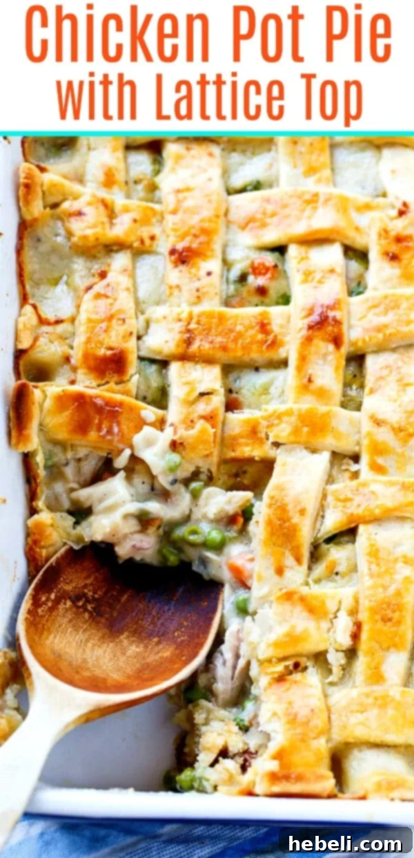 Large chicken pot pie baked in a 9x13-inch pan, showcasing a perfect golden lattice top and a rich filling.
