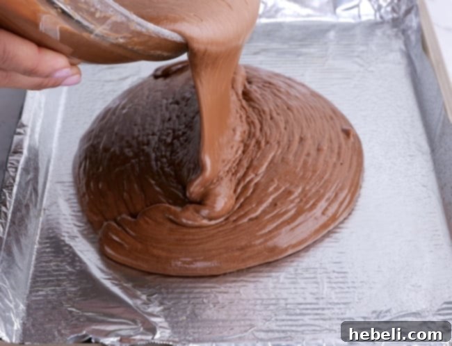Pouring batter into pan.