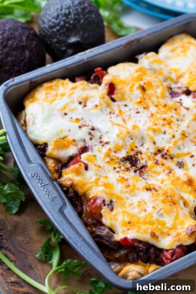 Loaded Taco Bake Squares 3 Deep Dish Taco Squares feature a simple, golden biscuit crust made from Bisquick, perfect for holding the savory fillings.