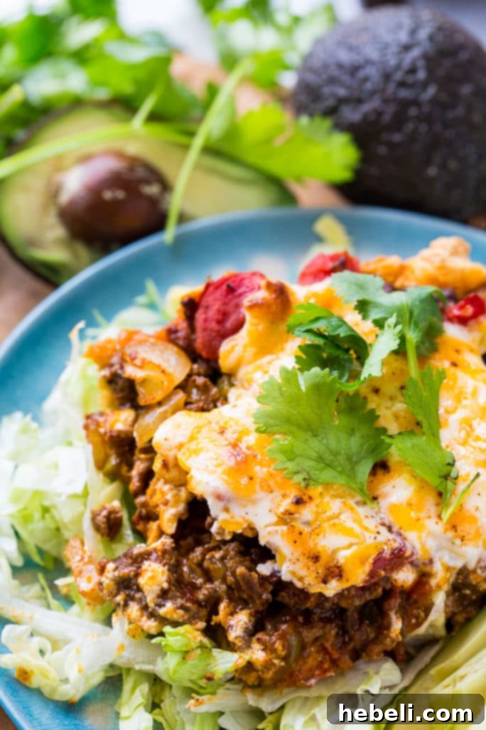 Loaded Taco Bake Squares 5 Deep Dish Taco Squares are topped with a creamy, cheesy layer of sour cream, mayonnaise, cheddar, and diced tomatoes, then baked to golden perfection.