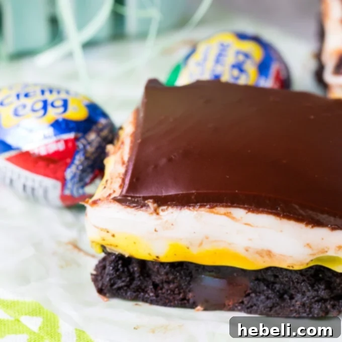Decadent Cadbury Egg Brownies 2 Decadent Cadbury Creme Egg Brownies with fudgy base and creamy filling, sliced to show layers