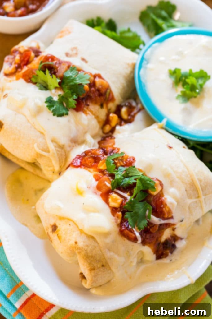 Making Pulled Pork Burritos with Cheesy Sour Cream Sauce, perfect for Cinco de Mayo celebrations