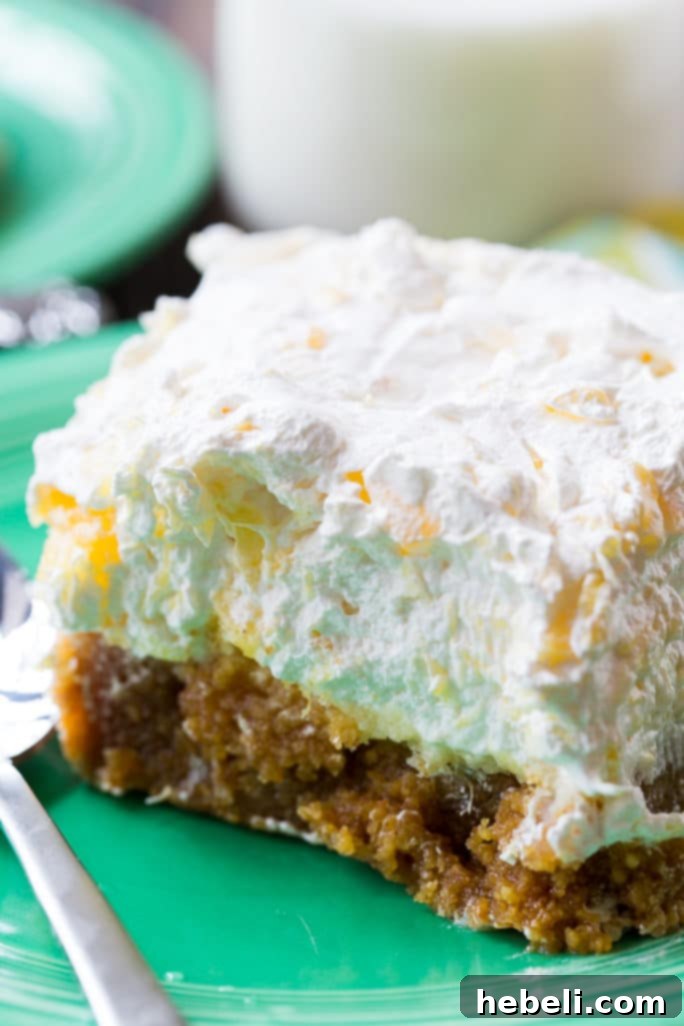 A tray of freshly made Pineapple Delight, garnished with a few mint leaves and ready to be served.