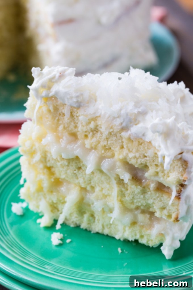 Another beautiful shot of the Coconut Celebration Cake, emphasizing its fluffy layers.