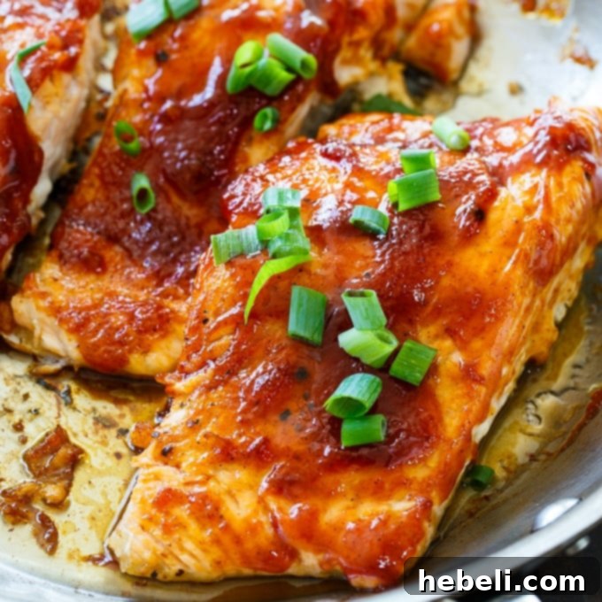 Delicious Honey BBQ Salmon served with a side of fresh salad.