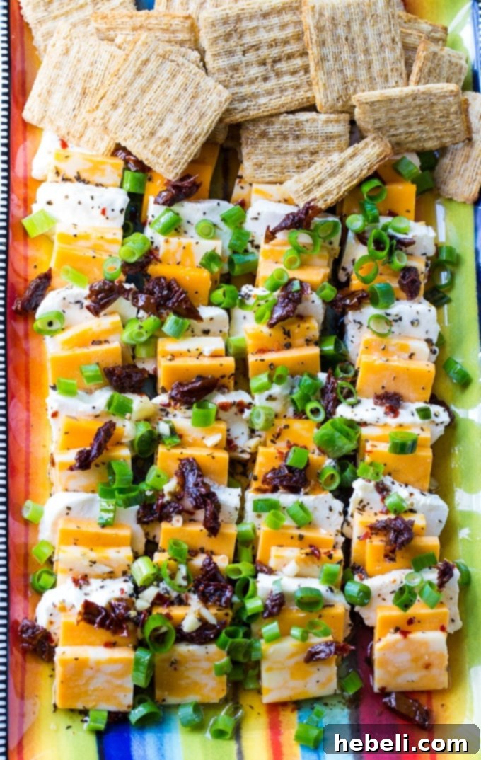 Spiced Cheese Infusion 3 Spicy Marinated Cheese makes an easy party appetizer for any event.