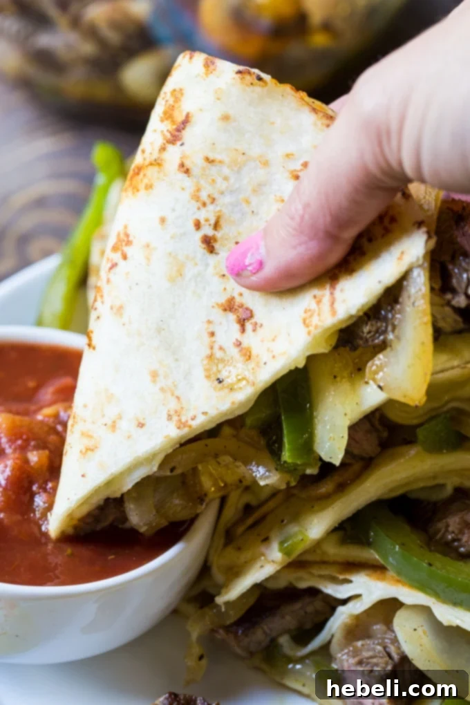 Philly Cheese Steak Quesadillas arranged neatly, highlighting the golden tortillas and generous filling.