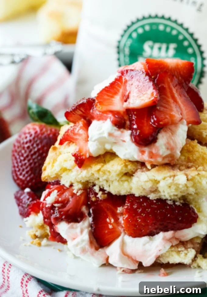 An assembled Easy Strawberry Shortcake, showcasing its inviting layers of biscuit, strawberries, and cream.