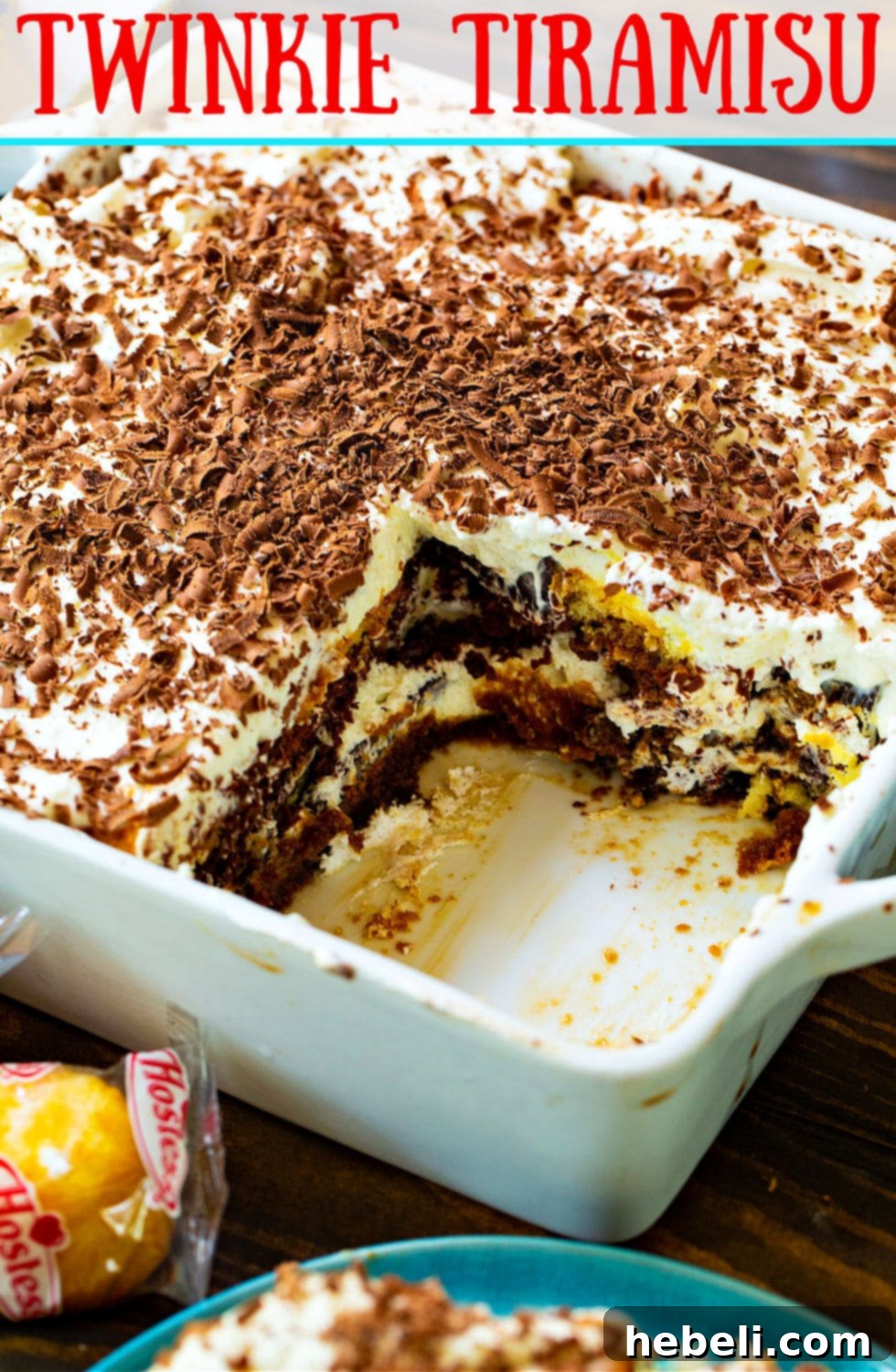 A beautifully presented whole Twinkie Tiramisu dessert, ready for serving, with a rich chocolate topping.