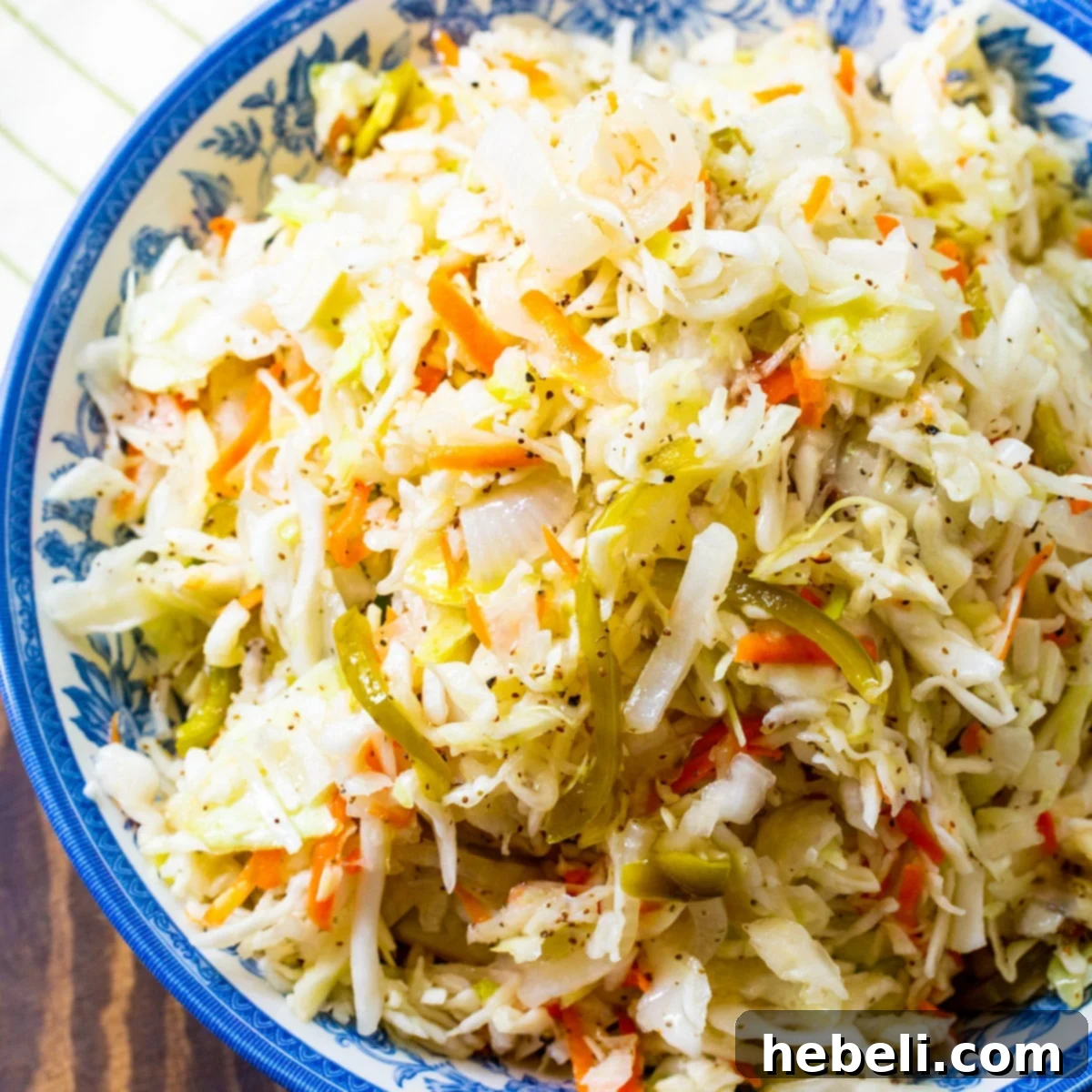 Delightfully Sweet Vinegar Slaw 2 Sweet Vinegar Coleslaw in a rustic blue and white bowl, ready for serving.