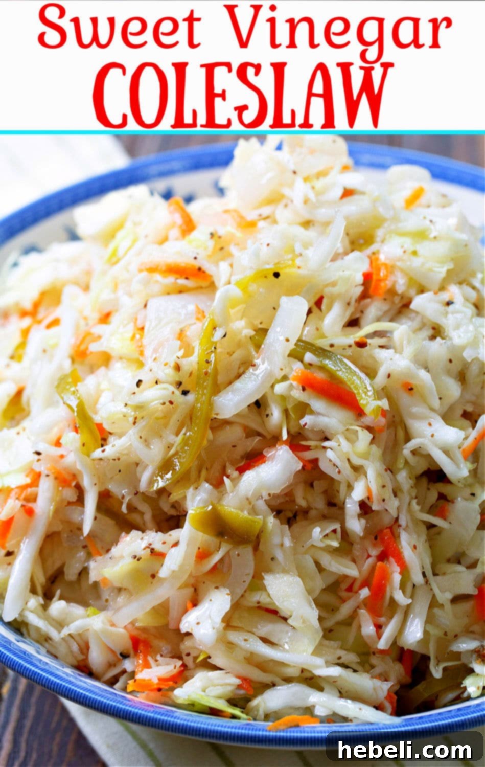 Delightfully Sweet Vinegar Slaw 7 Sweet Vinegar Coleslaw in a white bowl with a wooden spoon, showcasing its texture.