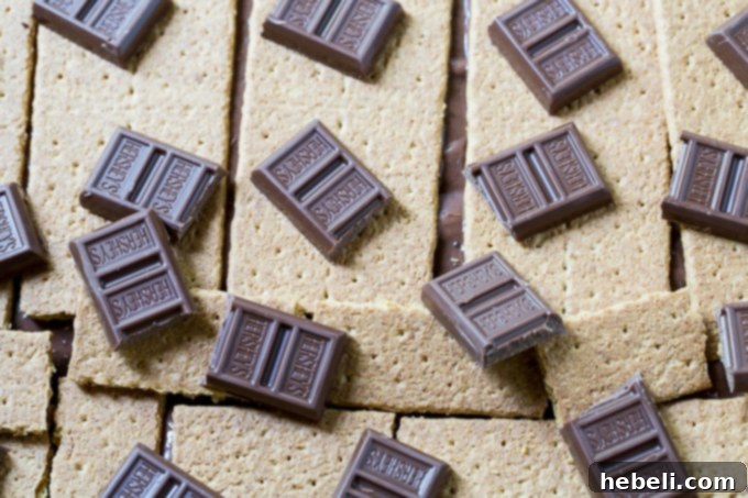 S'mores Cobbler 5 Layering graham crackers and Hershey's chocolate for S'mores Cobbler