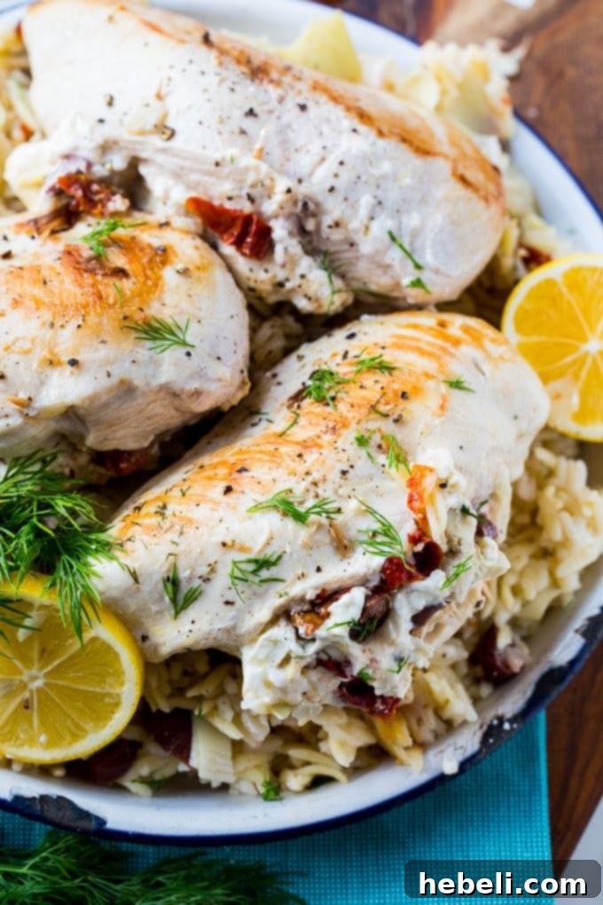 Close-up of Greek Stuffed Chicken filling ingredients: feta cheese, olives, artichoke hearts, and sun-dried tomatoes.