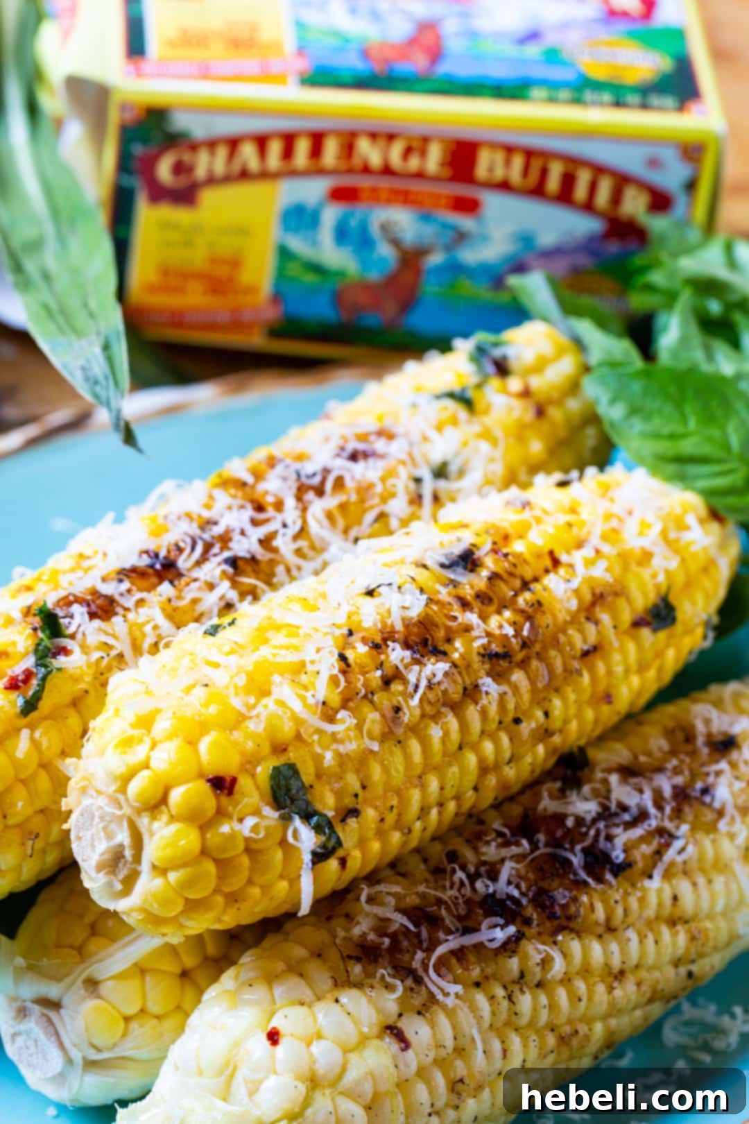 Grilled corn and a box of Challenge Butter, highlighting the quality ingredient used.