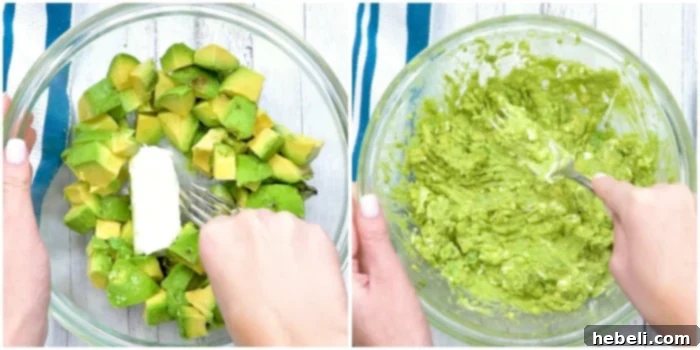 Mashing ripe avocados and softened cream cheese together in a bowl until smooth and creamy.