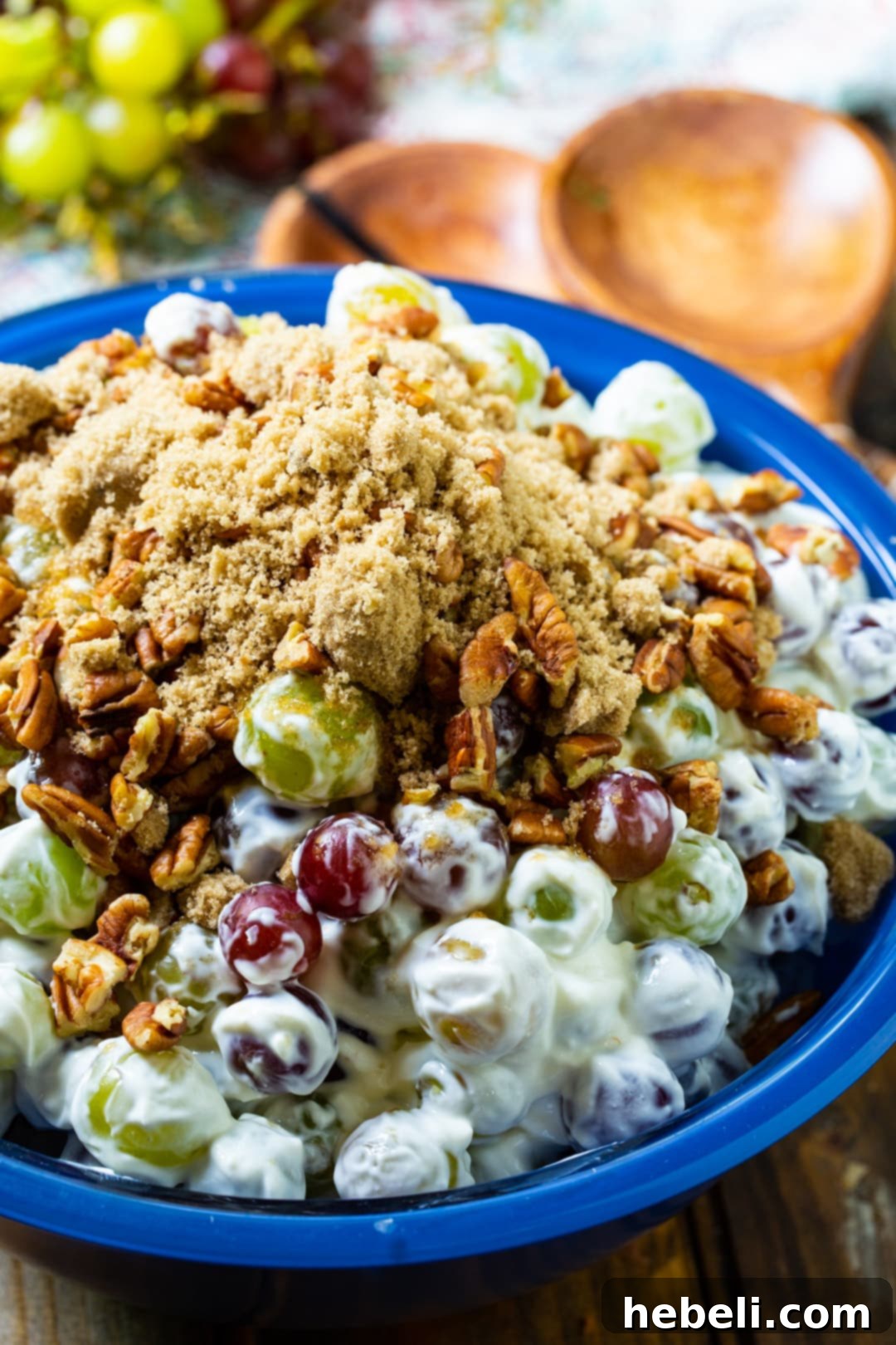 Creamy Grape Salad artfully arranged in a large blue bowl, ready to serve.